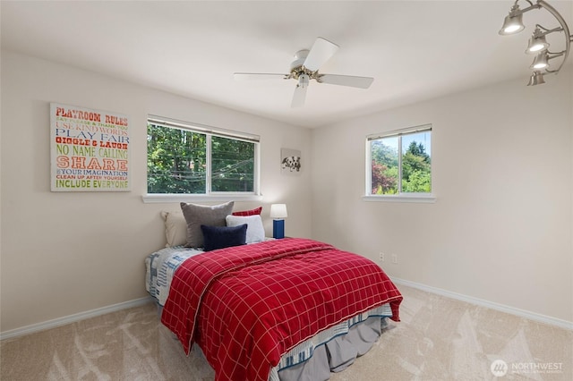 19508 23rd Ave NE, Shoreline, WA 98155 - carpeted bedroom featuring baseboards and a ceiling fan