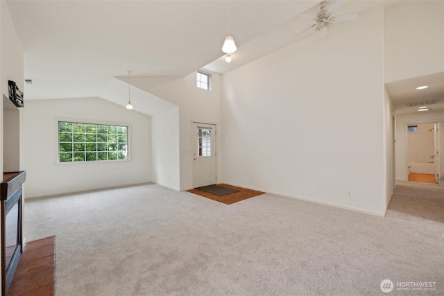 424 Wilson Ln, Sumas, WA 98295 - unfurnished living room featuring carpet, high vaulted ceiling, and ceiling fan