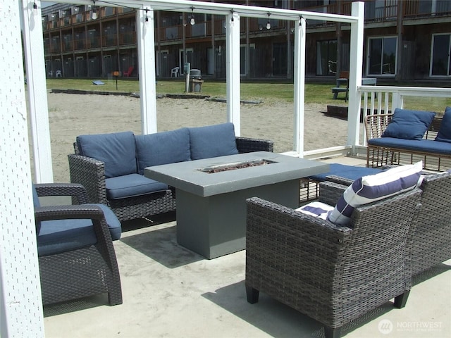 304 NW 14th St NW Unit 207, Long Beach, WA 98631 - view of patio featuring an outdoor living space with a fire pit
