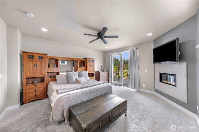 1301 Broad St, Bellingham, WA 98229 - bedroom with access to outside, light colored carpet, a glass covered fireplace, recessed lighting, and ceiling fan