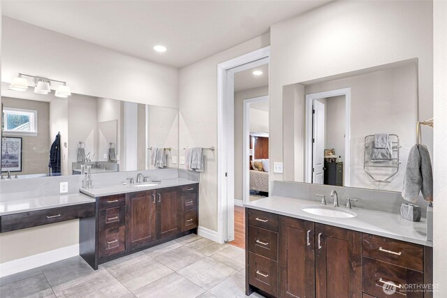 1301 Broad St, Bellingham, WA 98229 - ensuite bathroom featuring two vanities, tile patterned flooring, and recessed lighting
