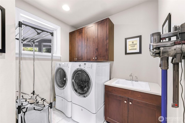 1301 Broad St, Bellingham, WA 98229 - washroom with cabinet space, washer and clothes dryer, and light tile patterned floors