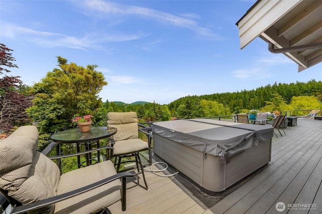 1301 Broad St, Bellingham, WA 98229 - wooden deck with area for grilling, a hot tub, and a wooded view