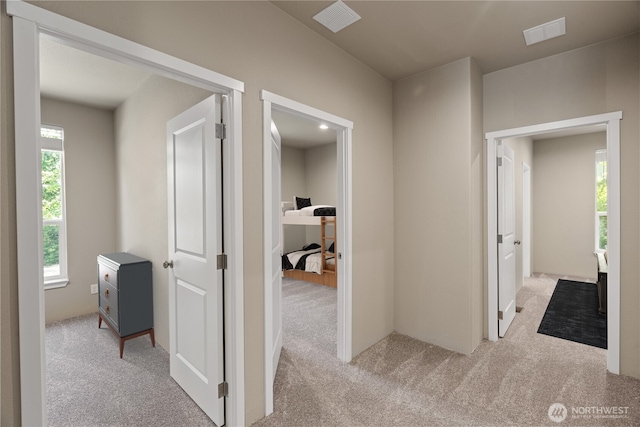 712 Syzygy Ct SE, Ocean Shores, WA 98569 - hallway featuring light colored carpet