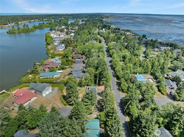712 Syzygy Ct SE, Ocean Shores, WA 98569 - aerial view of property and surrounding area featuring a nearby body of water and nearby suburban area