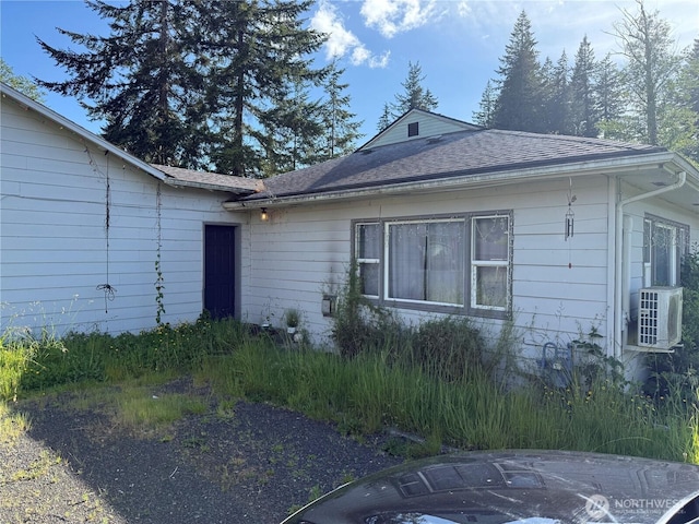 419 W Oak St, Mccleary, WA 98557 - view of side of home with cooling unit and a shingled roof
