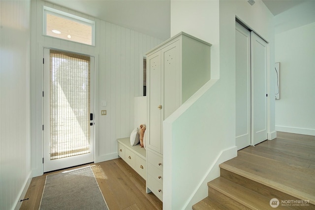 9208 11th Ave NW, Seattle, WA 98117 - entrance foyer featuring wood finished floors, stairs, and healthy amount of natural light