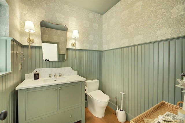 9208 11th Ave NW, Seattle, WA 98117 - half bath with wood finished floors, vanity, and wallpapered walls
