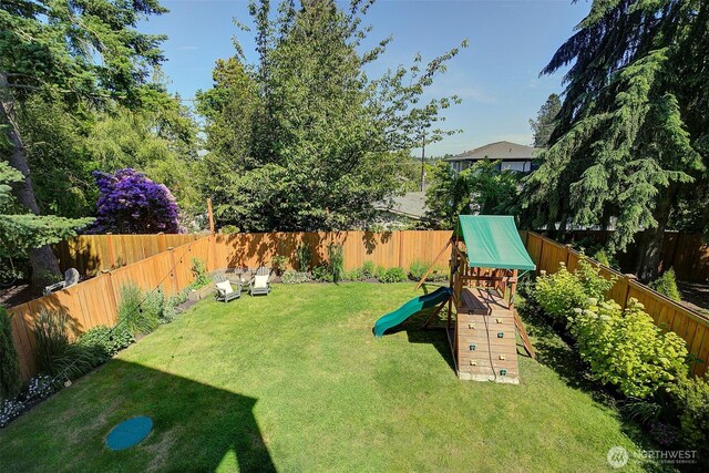 9208 11th Ave NW, Seattle, WA 98117 - fenced backyard featuring a playground