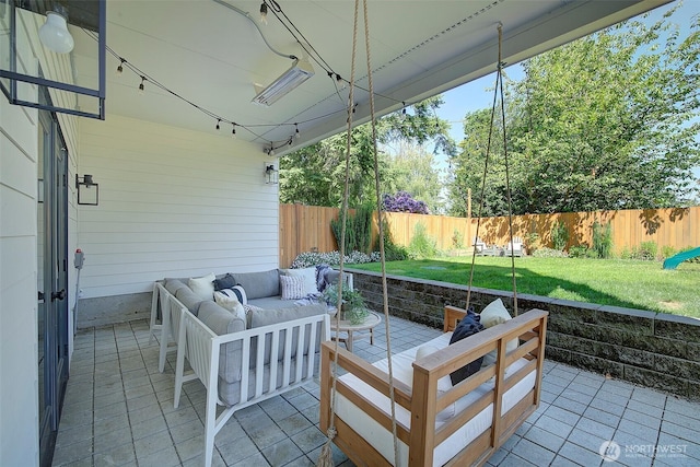 9208 11th Ave NW, Seattle, WA 98117 - fenced backyard with outdoor lounge area and a patio area