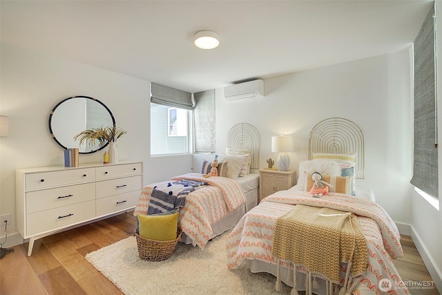 9208 11th Ave NW, Seattle, WA 98117 - bedroom featuring a wall mounted AC and wood finished floors