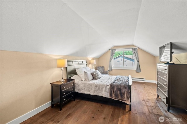 13228 202nd Ave SE, Issaquah, WA 98027 - bedroom featuring hardwood / wood-style floors, a baseboard radiator, and vaulted ceiling