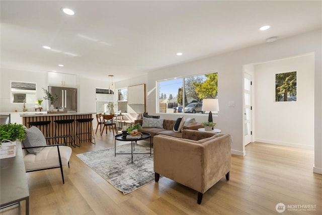 12852 Occidental Ave S, Seattle, WA 98168 - living room featuring light wood finished floors and recessed lighting