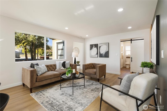 12852 Occidental Ave S, Seattle, WA 98168 - living room with a barn door, light wood finished floors, and recessed lighting