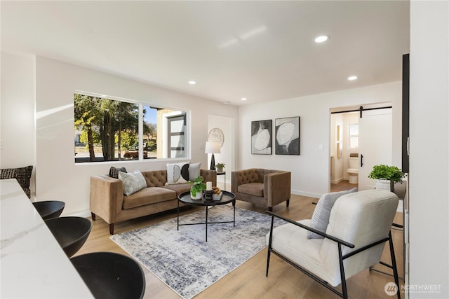 12852 Occidental Ave S, Seattle, WA 98168 - living room with recessed lighting, wood finished floors, and a barn door
