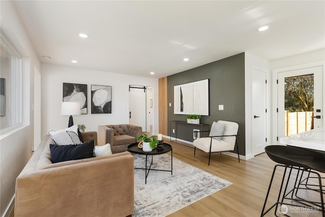 12852 Occidental Ave S, Seattle, WA 98168 - living room with light wood finished floors, recessed lighting, and a barn door