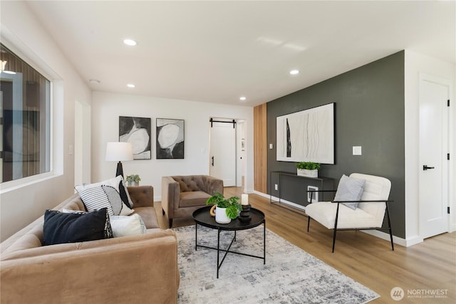 12852 Occidental Ave S, Seattle, WA 98168 - living area with light wood-type flooring, recessed lighting, and a barn door