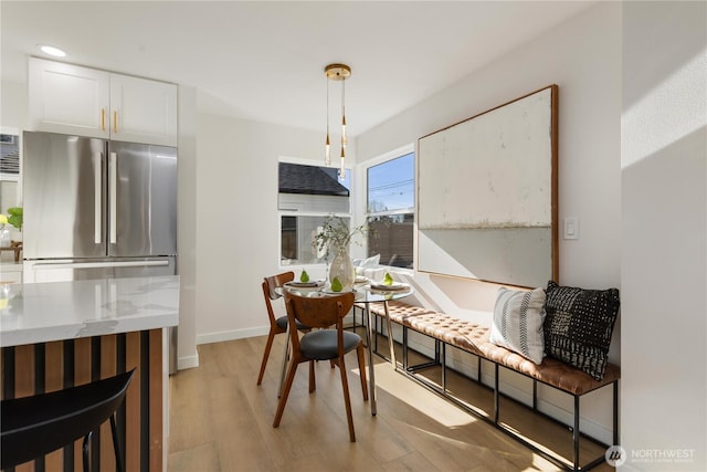 12852 Occidental Ave S, Seattle, WA 98168 - dining space with light wood-style flooring and recessed lighting