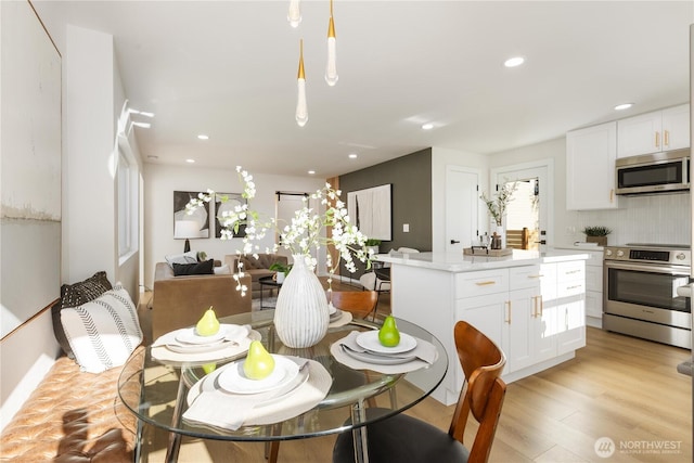 12852 Occidental Ave S, Seattle, WA 98168 - dining room featuring light wood finished floors and recessed lighting