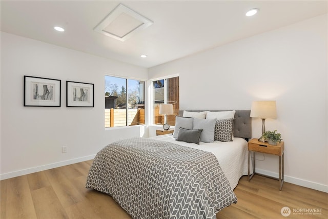 12852 Occidental Ave S, Seattle, WA 98168 - bedroom featuring attic access, wood finished floors, and recessed lighting