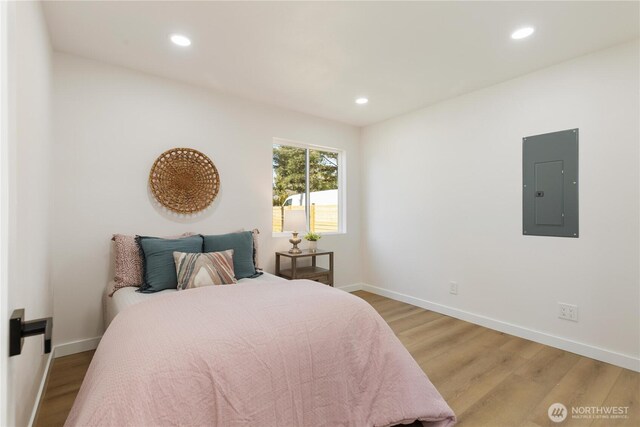 12852 Occidental Ave S, Seattle, WA 98168 - bedroom with electric panel, light wood finished floors, and recessed lighting