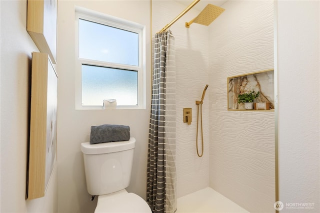 12852 Occidental Ave S, Seattle, WA 98168 - bathroom with toilet and a shower with shower curtain