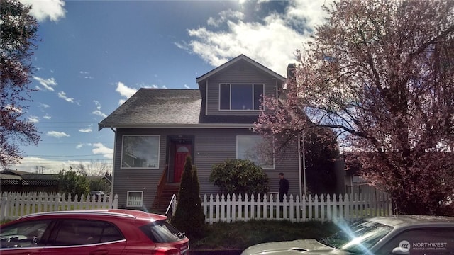306 2nd St NE, Auburn, WA 98002 - view of front facade with a chimney and a fenced front yard