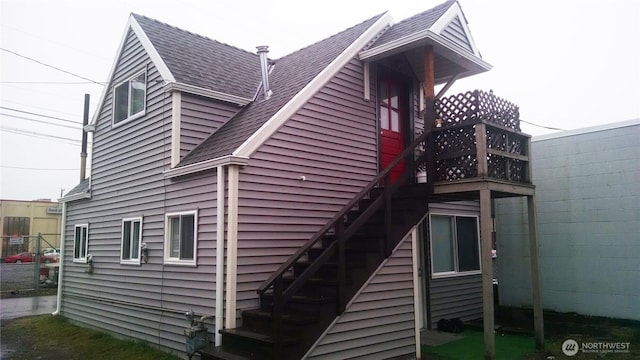 306 2nd St NE, Auburn, WA 98002 - rear view of property featuring a shingled roof and stairway