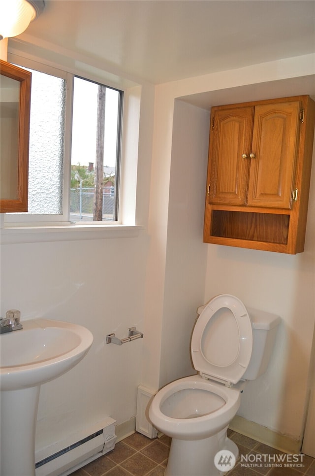306 2nd St NE, Auburn, WA 98002 - half bathroom featuring a baseboard heating unit and baseboards