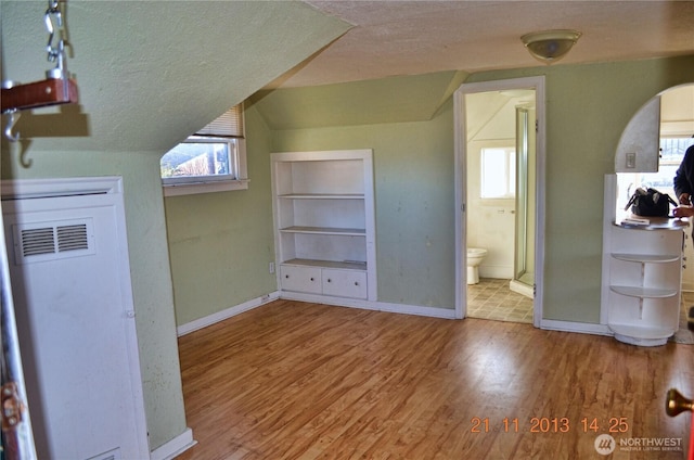306 2nd St NE, Auburn, WA 98002 - additional living space with a textured ceiling, wood finished floors, plenty of natural light, and built in features