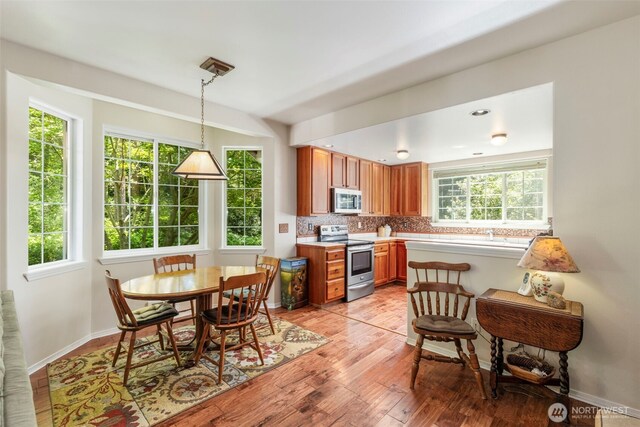 4766 Mason St, Port Townsend, WA 98368 - dining space with healthy amount of natural light and light wood finished floors