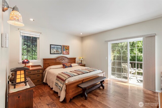 4766 Mason St, Port Townsend, WA 98368 - bedroom featuring access to exterior, wood finished floors, multiple windows, and recessed lighting