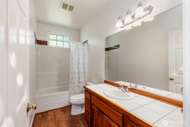 4766 Mason St, Port Townsend, WA 98368 - full bath featuring shower / bath combo, wood finished floors, and vanity