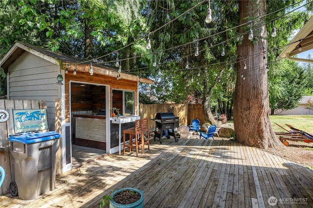 5850 Rest Pl NE, Bremerton, WA 98311 - wooden deck with grilling area and an outdoor structure