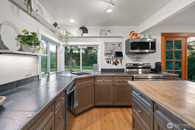14855 Phelps Rd NE, Bainbridge Island, WA 98110 - kitchen featuring stainless steel appliances, plenty of natural light, light wood-type flooring, and recessed lighting