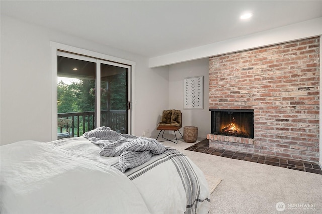 14855 Phelps Rd NE, Bainbridge Island, WA 98110 - bedroom with access to outside, carpet, and a brick fireplace