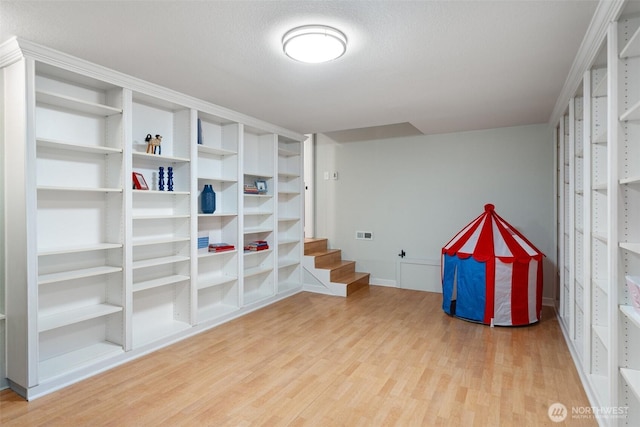 14855 Phelps Rd NE, Bainbridge Island, WA 98110 - playroom with wood finished floors and baseboards