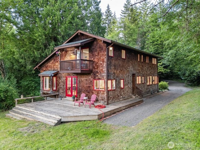 14855 Phelps Rd NE, Bainbridge Island, WA 98110 - back of house featuring a yard, a balcony, a deck, and french doors
