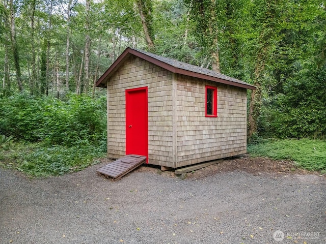 14855 Phelps Rd NE, Bainbridge Island, WA 98110 - view of shed featuring a wooded view