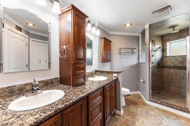 3035 Carbon Ridge St, Enumclaw, WA 98022 - bathroom with double vanity, a tile shower, crown molding, stone finish flooring, and recessed lighting