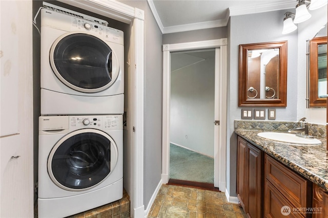3035 Carbon Ridge St, Enumclaw, WA 98022 - laundry room with stacked washer / drying machine, ornamental molding, and stone finish flooring