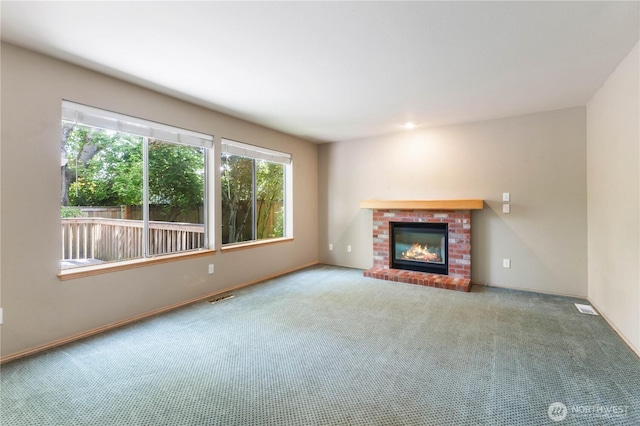 3035 Carbon Ridge St, Enumclaw, WA 98022 - unfurnished living room with carpet flooring and a brick fireplace