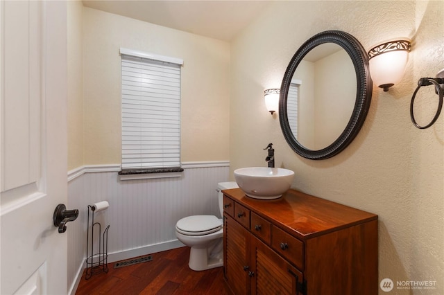 3035 Carbon Ridge St, Enumclaw, WA 98022 - bathroom featuring wood finished floors, wainscoting, and vanity