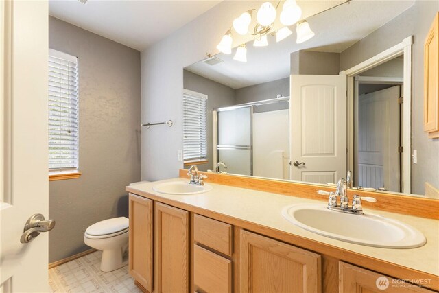 3035 Carbon Ridge St, Enumclaw, WA 98022 - bathroom with a shower stall, double vanity, tile patterned floors, and a chandelier