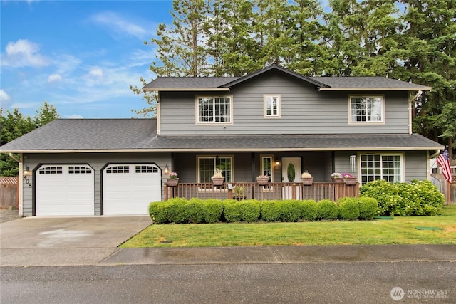408 Cross Creek Ct, South Prairie, WA 98385 - traditional home featuring an attached garage, a porch, concrete driveway, and a front lawn