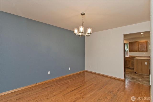 408 Cross Creek Ct, South Prairie, WA 98385 - empty room with light wood-style floors and a chandelier