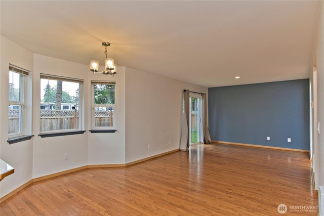 408 Cross Creek Ct, South Prairie, WA 98385 - empty room with wood finished floors, a chandelier, and recessed lighting