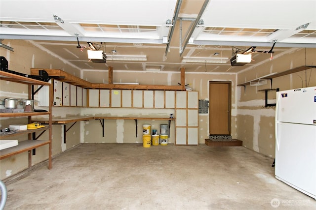 408 Cross Creek Ct, South Prairie, WA 98385 - garage featuring freestanding refrigerator and a garage door opener
