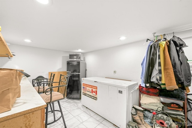 1501 Lakeway Dr, Bellingham, WA 98225 - laundry area with light marble finish flooring and recessed lighting