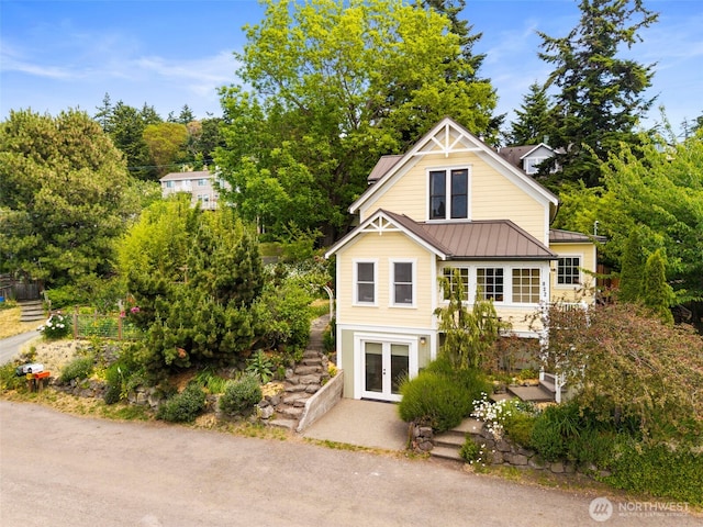 832 Willow St, Port Townsend, WA 98368 - view of front of home featuring french doors, a standing seam roof, and a metal roof